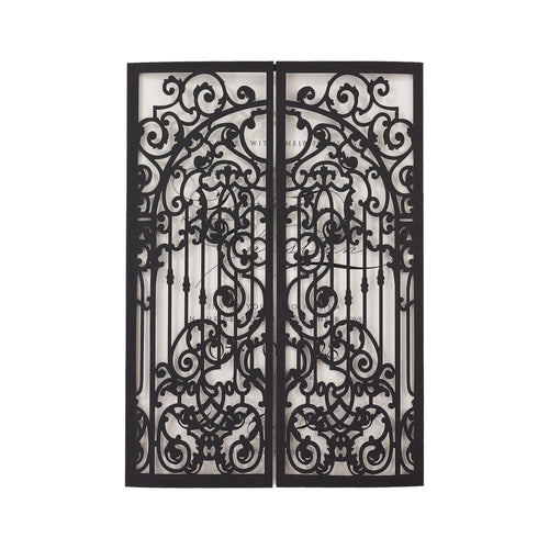 One black gates with intricate scrollwork designs. The gates are open and the scrollwork is visible through the openings. The text 'WITH THE HEART OF ONE' is visible through the scrollwork.