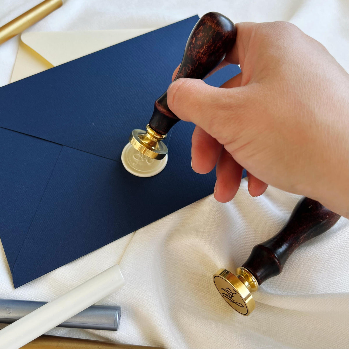 High-quality wax seal stamp with smooth wooden handles and precision-engraved custom initials.